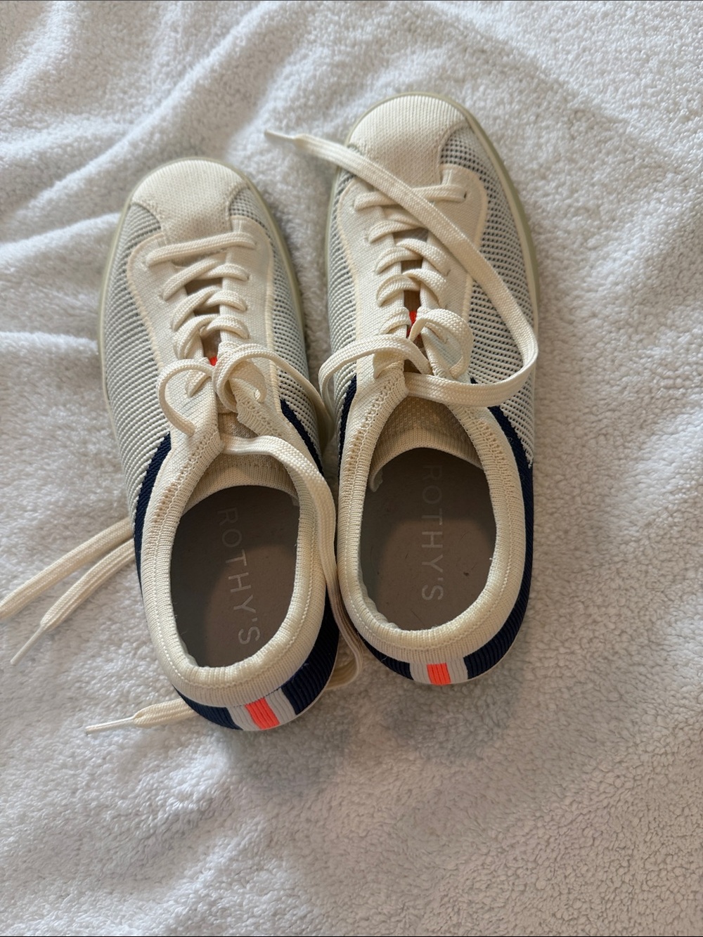 Rothy's Women’s Cream Knit Sneakers with Navy Trim and Orange Accent